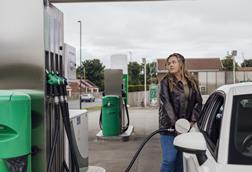 Getty woman filling up car
