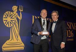 Ken McMeikan, CEO of Moto Hospitality, recieves the CEO of the Year Award from British Business Awards host, Rob Brydon