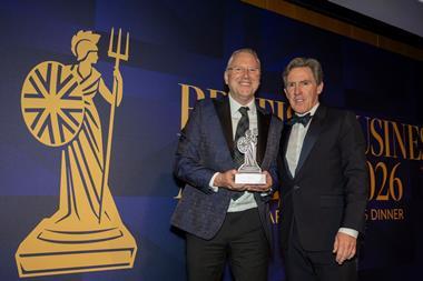 Ken McMeikan, CEO of Moto Hospitality, recieves the CEO of the Year Award from British Business Awards host, Rob Brydon