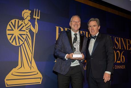 Ken McMeikan, CEO of Moto Hospitality, recieves the CEO of the Year Award from British Business Awards host, Rob Brydon