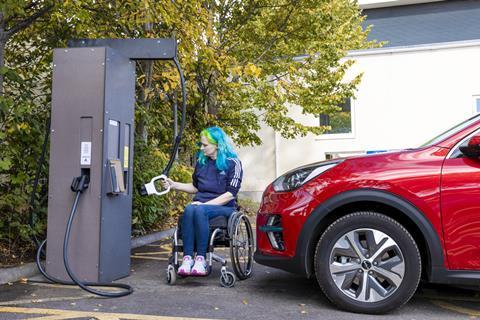 Wheelchair user with EV charger
