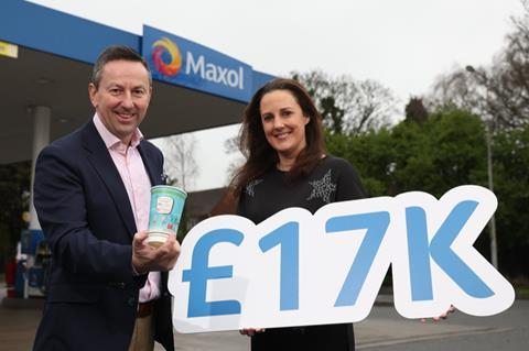 Maxol CEO Brian Donaldson celebrates a £17,000 sum raised for Aware NI, with Aware’s head of fundraising Clare Galbraith