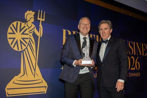 Ken McMeikan, CEO of Moto Hospitality, recieves the CEO of the Year Award from British Business Awards host, Rob Brydon