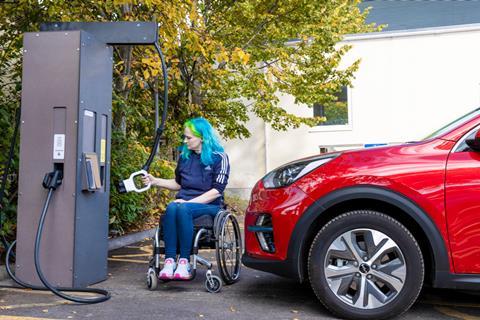 Wheelchair user with EV charger